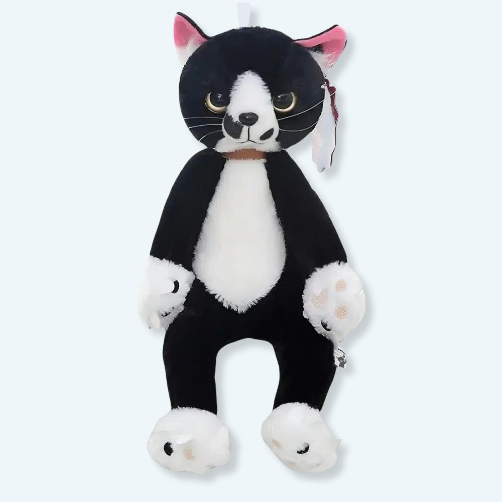 Peluche chat noir et blanc mécontent assis