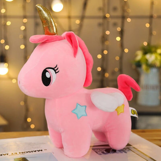 Peluche licorne rose de corne dorée