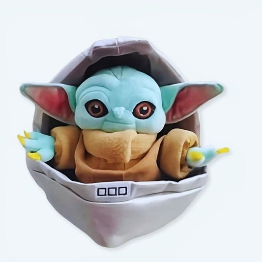 Peluche Baby Yoda dans son berceau