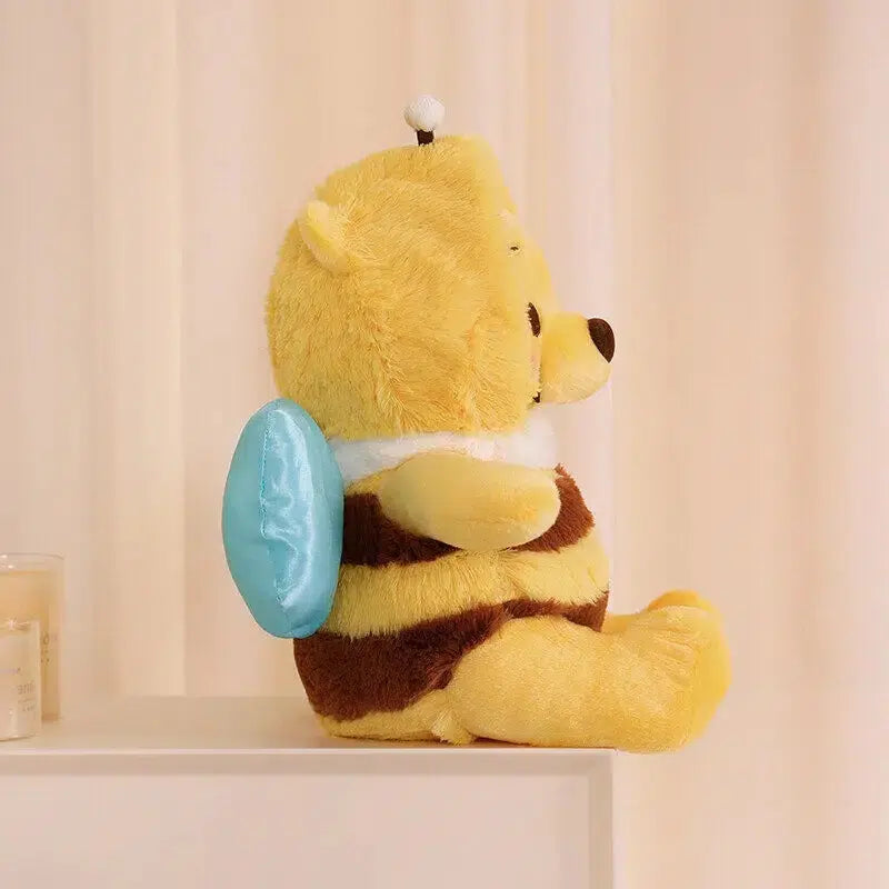 Peluche Winnie l’ourson en abeille